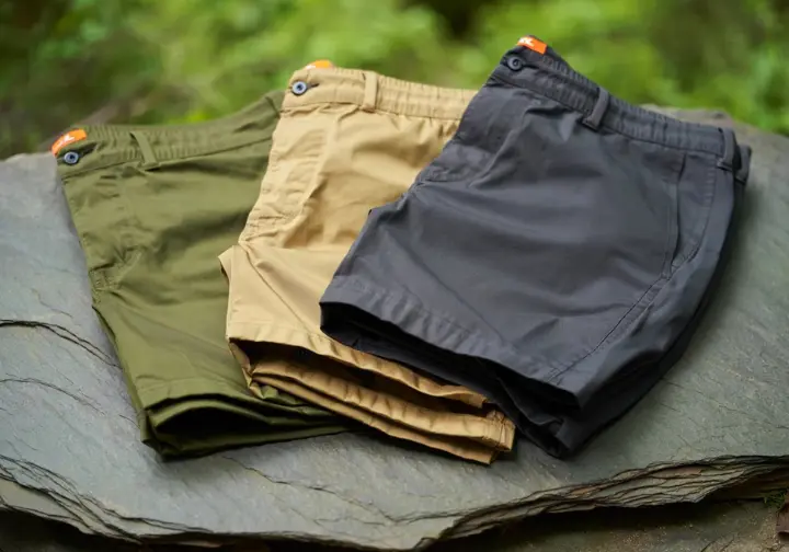 Three pairs of the best men's hiking shorts of 2025 are displayed, showcasing the top picks for different hiking needs.
