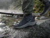 6 Men’s Waterproof Shoes Compared One Honest Pick Men's waterproof hiking shoe on wet granite beside a shallow trail creek at dawn