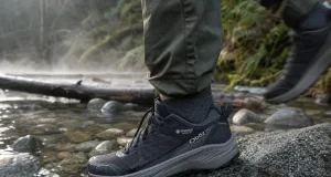 6 Men’s Waterproof Shoes Compared One Honest Pick Men's waterproof hiking shoe on wet granite beside a shallow trail creek at dawn