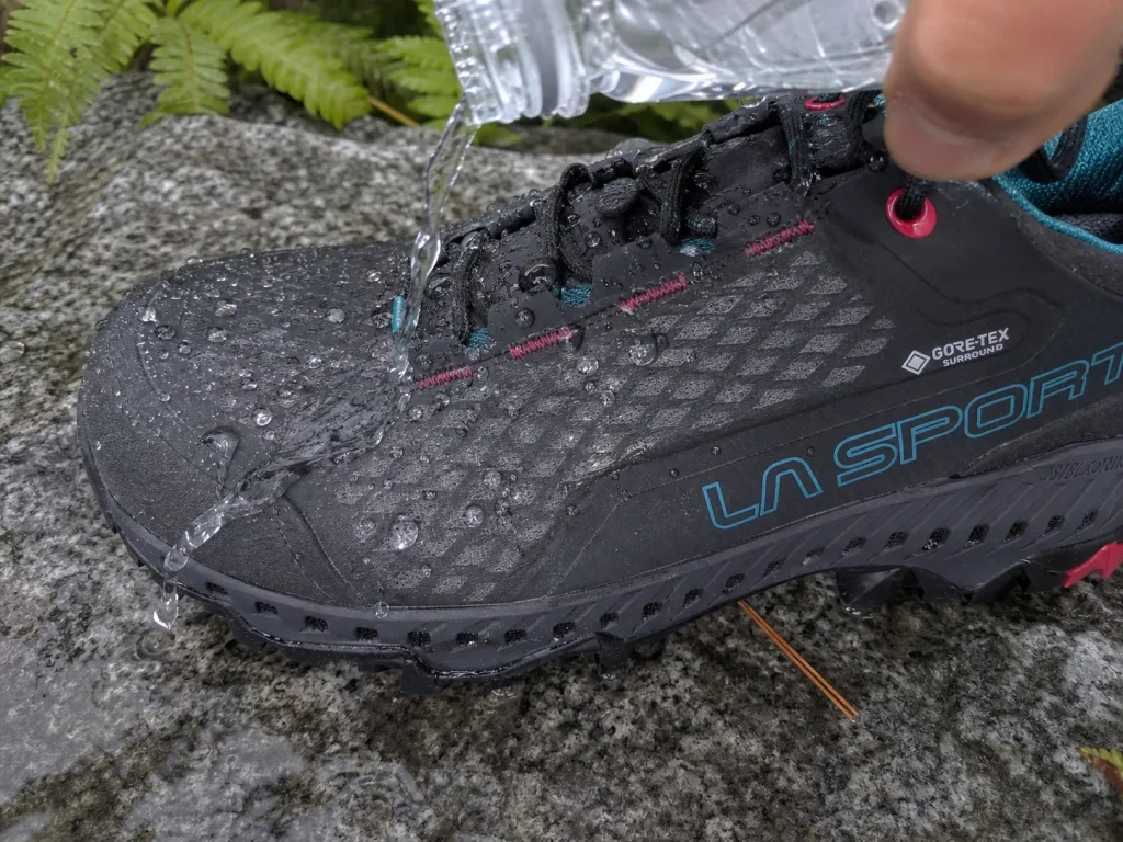 Close-up of water beading on the treated upper of a Gore-Tex waterproof hiking shoe
