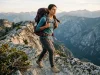 Best Women’s Hiking Backpack for Your Body Type Woman hiking a ridgeline wearing a fitted women's hiking backpack at golden hour