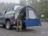 Pickup Truck Bed Tent Types Explained for Hikers Pickup truck bed tent pitched in a pickup bed at a gravel trailhead lot on a grey morning