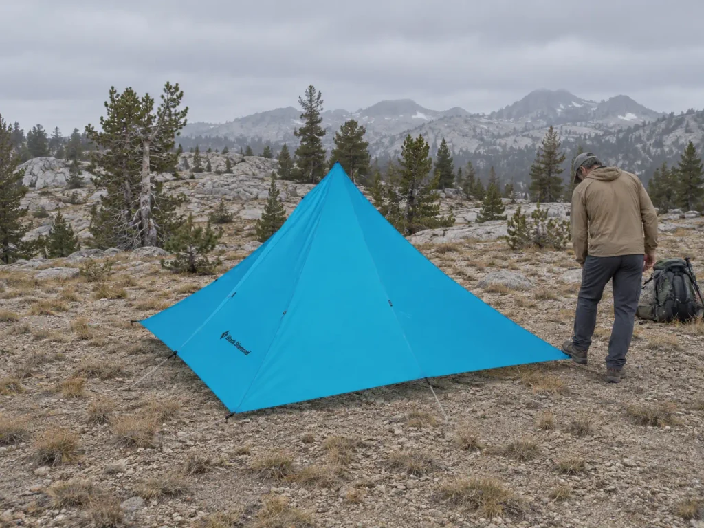 Floorless pyramid shelter pitched on a single center pole in the Sierra Nevada