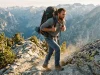 Best Men’s Hiking Backpacks for Every Trip 2026 Man hiking a granite ridge with a loaded men's hiking backpack at golden hour