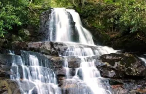 Laurel Falls Trail: How to Beat the Crowds & Find Parking Laurel Falls with its 80-foot waterfall and newly paved trail, showing a serene scene with minimal crowds, illustrating how to beat the crowds and find parking for Laurel Falls Trail.