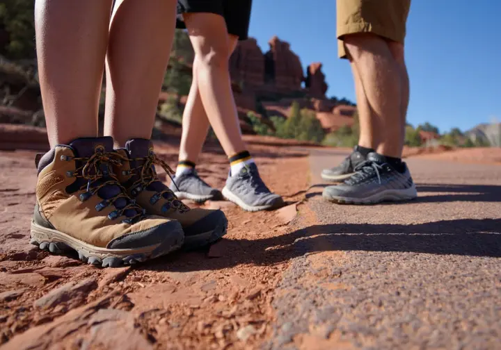 Three pairs of hiking shoes on different trail surfaces, illustrating the multi-level hiking options around Bell Rock.