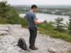 Minnewaska State Park Has 3 Areas Here’s Which to Hike Hiker checking a trail map where the carriage road splits above Lake Minnewaska State Park