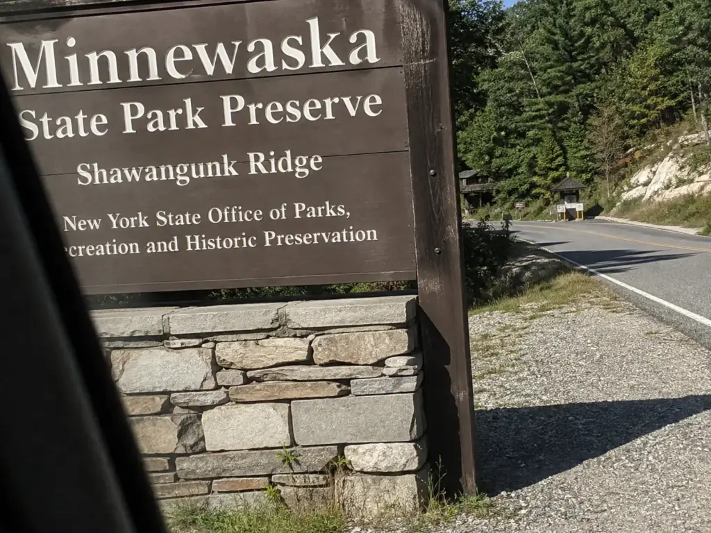 Brown state park entrance sign at the Minnewaska State Park Preserve access road