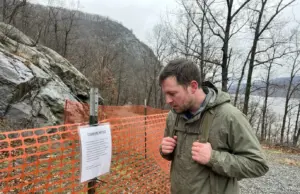 Breakneck Ridge Is Closed Until Mid-2027 Closed Breakneck Ridge trailhead fenced off below the Hudson Highlands ridgeline in New York