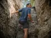 5 Lemon Squeeze Mistakes That End Hikes at Mohonk Hiker emerging from the Lemon Squeeze crevice at Mohonk Preserve on the Shawangunk Ridge