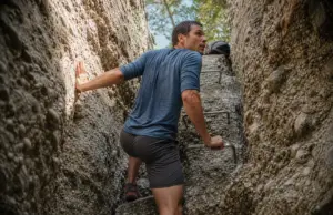5 Lemon Squeeze Mistakes That End Hikes at Mohonk Hiker emerging from the Lemon Squeeze crevice at Mohonk Preserve on the Shawangunk Ridge
