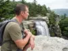 Verkeerder Kill Falls Isn’t 187 Feet Tall Anymore Hiker at the top viewpoint of Verkeerder Kill Falls in Sam's Point Preserve, New York