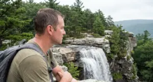 Verkeerder Kill Falls Isn’t 187 Feet Tall Anymore Hiker at the top viewpoint of Verkeerder Kill Falls in Sam's Point Preserve, New York