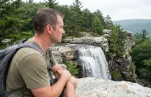 Verkeerder Kill Falls Isn’t 187 Feet Tall Anymore Hiker at the top viewpoint of Verkeerder Kill Falls in Sam's Point Preserve, New York