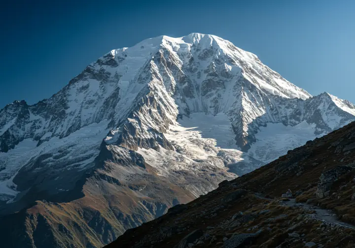 Majestic snow-capped mountain peak in Colorado, showcasing an iconic mountain experience with a hiking trail.