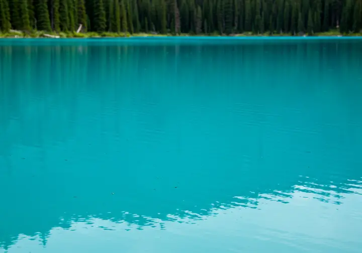 Close-up of the stunning turquoise water of Joffre Lakes, showcasing glacial silt and vibrant color.