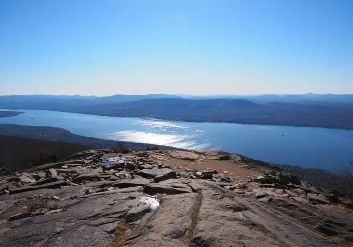 The unforgettable panoramic view from the summit of Turkey Mountain, showing the Croton Reservoir and the Hudson Highlands on a clear day.
