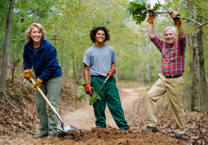 A diverse group of volunteers works together on trail maintenance at Turkey Mountain Nature Preserve, symbolizing a legacy of conservation.