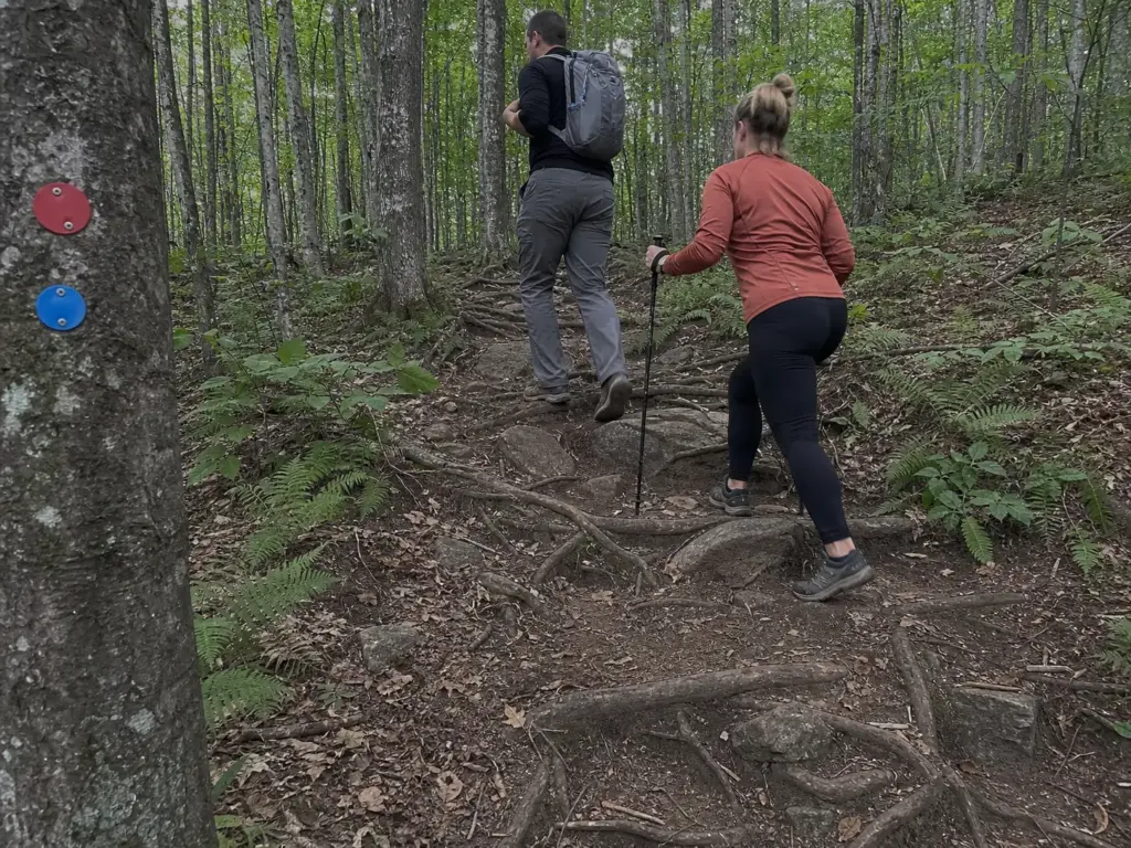 Hikers on the red and blue marked route up Cat Mountain near Lake George, NY