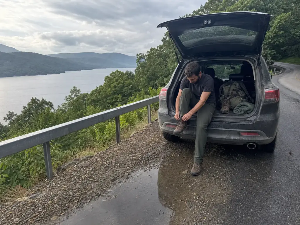 Parked car on a shoreline road heading to east-side hiking trails near Lake George NY