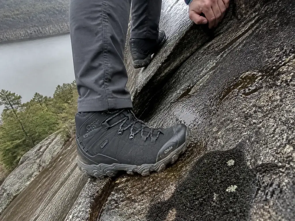 Waterproof boots on wet rock during a scramble section on a Cold Spring NY hiking trail