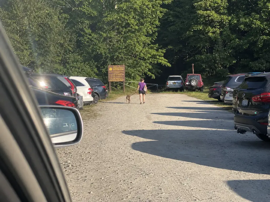 Full gravel parking lot at a Prospect Mountain trailhead near Lake George Village NY