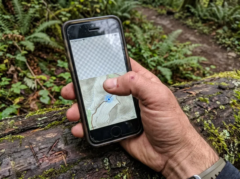 Close-up of a phone showing a half-loaded map in a no-signal dead zone