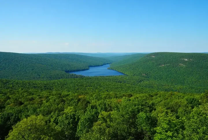 Panoramic view of Sterling Forest State Park NY's expansive forests and hills, representing a year-round nature escape.
