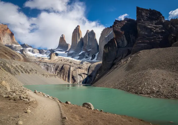 Key Patagonia hiking destination: The iconic granite towers of Torres del Paine National Park, Chile, viewed from a trail.