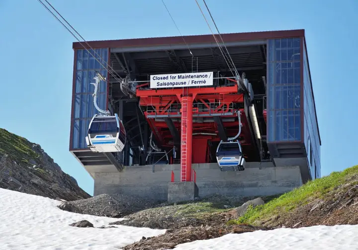 Closed mountain cable car station in Switzerland during May, illustrating the need to check infrastructure status.
