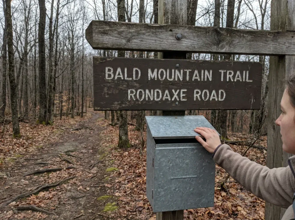 Trailhead sign and register box at the start of the Bald Mountain hiking trails on Rondaxe Road