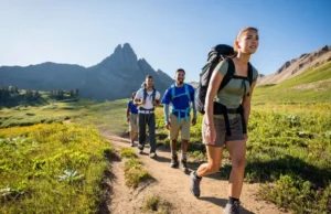 Pacing Yourself on a Hike: How to Manage Energy and Avoid Burnout Diverse hikers demonstrating effective pacing on a scenic mountain trail, embodying sustained endurance and energy management for longer hikes.