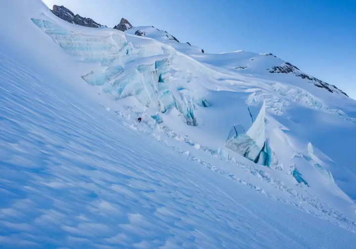 A very steep, icy mountain slope illustrating the limits of self-arrest effectiveness in challenging conditions, providing advanced context for fall stopping.