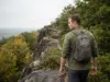 Hiking Places in Connecticut Sorted by Your Day Hiker on the traprock ridge trail at Talcott Mountain, one of the best hiking places in Connecticut.