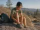 Best Zero-Drop Hiking Shoes and Who Should Skip Them Hiker lacing zero-drop hiking shoes on a granite ledge in the Sierra Nevada