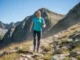 Rock Plates in Hiking Shoes: A Data-Backed Breakdown A fit redhead woman in her late 20s hiking with confidence over a rocky mountain path on a sunny day.