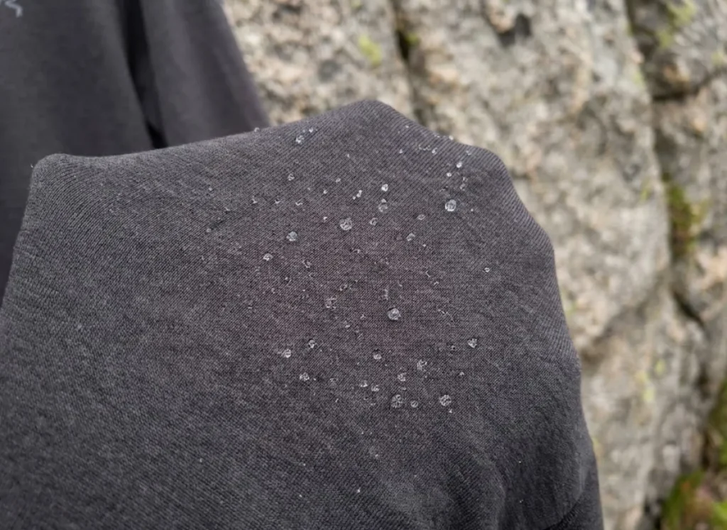 Macro photography of Arc'teryx Cormac polyester fabric weave showing texture and water resistance.