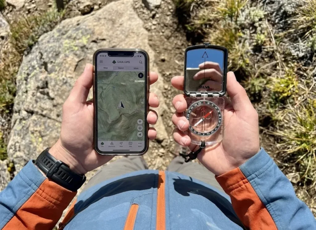 Comparing Gaia GPS app bearing on a smartphone with a Silva Expedition S analog compass in the field.