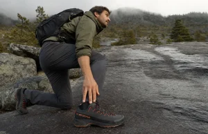 Approach Shoes vs Hiking Shoes Which Wins Where Hiker in approach shoes stepping onto a wet granite slab where the dirt trail ends