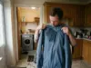 How to Wash a Gore-Tex Jacket Without Wrecking It Hiker checking where a Gore-Tex jacket has wet out before washing it at home