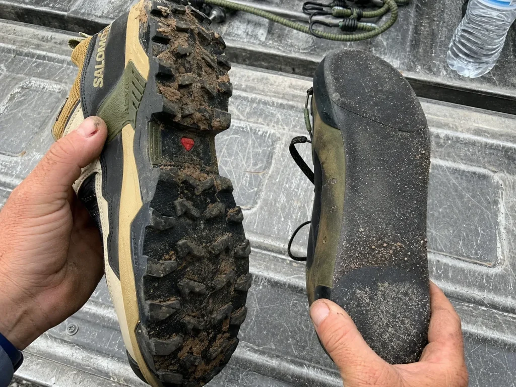 Two hiking shoe soles compared side by side, deep lugs versus a smooth approach-shoe toe