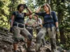 Diversity in the Outdoors: 20+ Groups & Inclusive Gear A candid shot of a diverse group of hikers taking a break on a steep trail, showing signs of exertion and authentic outdoor experience.