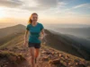The Best Hiking Insoles: Tested for Trail Endurance A fit redhead woman in her late 20s hiking with a smile on a sunny mountain trail.