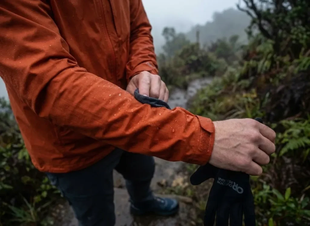 Water beading on DWR-treated wind shirt fabric after rain on hiking trail