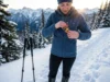 Layering Hand Warmers for All-Day Heat on the Trail Hiker placing hand warmer in fleece pocket on winter mountain trail for layered heat management