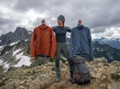 Hardshell vs Softshell: The Layering Decision Most Hikers Blow Hiker comparing hardshell and softshell jackets at alpine ridge pass with mountain views