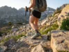 Hiking Shoe Toe Protection: End the Toenail Tax Hiker descending rocky alpine trail in Altra Lone Peak shoes with reinforced toe protection