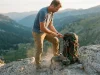 Why Most Hikers Don’t Need a Moldable Hip Belt Hiker cinching the hip belt on a loaded Osprey Aether pack to dial in moldable hip belt fit