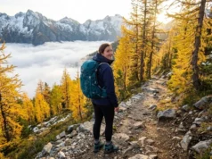 Shoulder Season Hiking: Why Smart Hikers Skip Peak Season Hiker on empty fall trail above cloud inversion during shoulder season in North Cascades