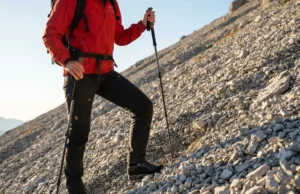 Tape Ankles to Prevent Sprains on Unstable Ground A professional hiker navigating technical scree terrain in the Dolomites wearing Arc'teryx and La Sportiva gear, demonstrating stability and confidence.
